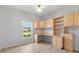 Bedroom with a built-in desk, shelving, and storage cabinets at 4110 Maplegrove Dr, Orlando, FL 32818