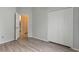 This spacious bedroom features wood laminate flooring and a closet at 4110 Maplegrove Dr, Orlando, FL 32818