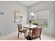 Cozy breakfast nook featuring a round table, three wood chairs, and bright natural lighting at 4110 Maplegrove Dr, Orlando, FL 32818
