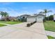 Charming one-story home featuring a well-manicured lawn and a spacious two-car garage at 4110 Maplegrove Dr, Orlando, FL 32818