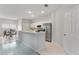 Bright kitchen featuring white cabinetry, stainless steel appliances, a breakfast nook and modern design at 4110 Maplegrove Dr, Orlando, FL 32818
