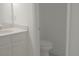Bright bathroom with a vanity and toilet in a well-lit space at 4167 Clifden Dr, Ormond Beach, FL 32174