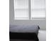 Bedroom featuring a dark bedspread and natural light streaming through the window at 4167 Clifden Dr, Ormond Beach, FL 32174