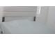 A bed with a padded headboard set against a window with white walls at 4167 Clifden Dr, Ormond Beach, FL 32174