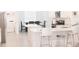 Bright, open kitchen with white cabinets, modern appliances, and an adjacent dining area at 4167 Clifden Dr, Ormond Beach, FL 32174