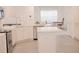 Spacious kitchen featuring stainless steel appliances, light countertops and island at 4167 Clifden Dr, Ormond Beach, FL 32174