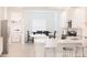 Bright, open kitchen with white cabinets, modern appliances, and an adjacent dining area at 4167 Clifden Dr, Ormond Beach, FL 32174