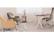 Bright office space with desk, stylish chairs, and ample natural light at 4167 Clifden Dr, Ormond Beach, FL 32174