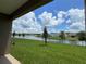 A beautiful backyard view of the lake surrounded by lush green grass at 4170 Sagefield Dr, Harmony, FL 34773