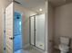 Bathroom featuring a glass shower, toilet, and doorway to another room at 4170 Sagefield Dr, Harmony, FL 34773