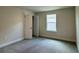 Inviting bedroom with gray carpet, ample natural light from the window, and white trim at 4170 Sagefield Dr, Harmony, FL 34773