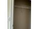 An empty closet featuring a metal wire shelf ready for customizable organization at 4170 Sagefield Dr, Harmony, FL 34773