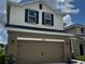 Inviting two-story home featuring a spacious two-car garage and well-kept front yard at 4170 Sagefield Dr, Harmony, FL 34773