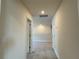 Hallway with carpet floors and doors leading to other rooms at 4170 Sagefield Dr, Harmony, FL 34773