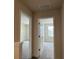 Upstairs hallway with bedrooms to either side and natural light from the windows at 4170 Sagefield Dr, Harmony, FL 34773