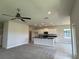 Modern kitchen with white cabinets, a central island, and stainless-steel appliances at 4170 Sagefield Dr, Harmony, FL 34773