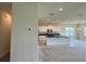 Open-concept kitchen featuring white cabinets, dark countertops, and stainless steel appliances at 4170 Sagefield Dr, Harmony, FL 34773