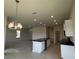 Contemporary kitchen with center island, pendant lighting, and stainless steel appliances at 4170 Sagefield Dr, Harmony, FL 34773