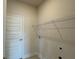 A functional laundry room with shelving for storage and modern utility connections at 4170 Sagefield Dr, Harmony, FL 34773