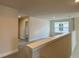 Cozy loft area with neutral carpet and a bright window at 4170 Sagefield Dr, Harmony, FL 34773