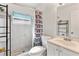 Bathroom featuring tiled walk-in shower, modern fixtures, and a sleek vanity at 4654 Alhama St, Orlando, FL 32811