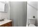 Functional bathroom featuring a clean toilet, neutral shower curtain, and sink for personal hygiene and grooming at 4654 Alhama St, Orlando, FL 32811