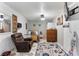Cozy bedroom featuring a comfortable bed, recliner, and a television for relaxation and entertainment at 4654 Alhama St, Orlando, FL 32811