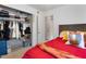 Bedroom with open closet, and a door leading to the bathroom at 4654 Alhama St, Orlando, FL 32811