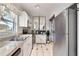 Efficient kitchen features updated appliances, white cabinets, and ample counter space for cooking at 4654 Alhama St, Orlando, FL 32811