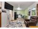 Inviting living room with a cozy seating area, a television for entertainment, and convenient access to the kitchen at 4654 Alhama St, Orlando, FL 32811