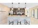 Stylish kitchen with a large island, pendant lights, and adjacent living area, perfect for entertaining at 5015 Starling Bird Ln, St Cloud, FL 34771
