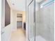 Stylish shower featuring glass enclosure and tiled walls, offering a modern and clean aesthetic at 5015 Starling Bird Ln, St Cloud, FL 34771