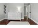 Bedroom featuring hardwood floors, neutral walls and a modern white dresser at 509 Altaloma Ave, Orlando, FL 32803