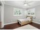 Bedroom with hardwood floors, neutral walls, two windows, and a twin bed at 509 Altaloma Ave, Orlando, FL 32803