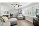 Living room featuring hardwood floors, a comfortable sectional sofa, and a large window with plantation shutters for privacy at 509 Altaloma Ave, Orlando, FL 32803
