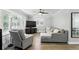 Inviting living room showcases hardwood floors, a comfortable sectional, and large windows with plantation shutters at 509 Altaloma Ave, Orlando, FL 32803