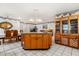Large kitchen with a central island and open layout to the dining and living areas at 5324 Barefoot Path, Kissimmee, FL 34746