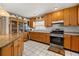 Well-equipped kitchen with stainless steel appliances, tile flooring, and ample counter space at 5324 Barefoot Path, Kissimmee, FL 34746
