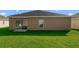 Spacious backyard with lush green grass, great for outdoor activities and relaxation at 540 Vitoria Rd, Davenport, FL 33837