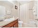 Cozy secondary bathroom with a shower-tub combo, single vanity, and neutral decor at 540 Vitoria Rd, Davenport, FL 33837