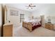 Serene bedroom with carpet flooring, warm lighting, and comfortable furnishings at 540 Vitoria Rd, Davenport, FL 33837