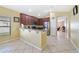 Well-lit kitchen with stainless appliances, granite countertops, and breakfast bar seating at 540 Vitoria Rd, Davenport, FL 33837