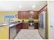 Modern kitchen featuring stainless steel appliances, granite countertops, and ample cabinetry at 540 Vitoria Rd, Davenport, FL 33837