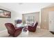 Cozy living room featuring tile flooring, and comfortable seating at 540 Vitoria Rd, Davenport, FL 33837