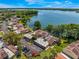 Aerial view of a lakeside community featuring lush greenery and ample parking with lake views at 604 Desoto Dr, Casselberry, FL 32707