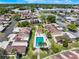 Aerial view of a community pool and surrounding buildings at 604 Desoto Dr, Casselberry, FL 32707