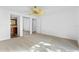 Carpeted bedroom connected to a bathroom and closet area at 604 Desoto Dr, Casselberry, FL 32707