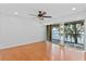 Bedroom with water view, hardwood floors, and a ceiling fan at 604 Desoto Dr, Casselberry, FL 32707