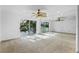 Large bedroom with mirrored wall and sliding glass doors to a balcony at 604 Desoto Dr, Casselberry, FL 32707