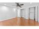Bright bedroom featuring hardwood floors and double closet doors at 604 Desoto Dr, Casselberry, FL 32707